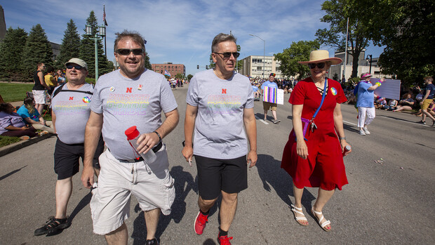 Corrie Svehla (second from left) walks the 2021 Star City Pride parade route with (from left) Bob Wilhelm, Ronnie Green and Jane Green. For his years of leadership, Svehla was honored with a Stellar Legacy award during the 2022 Star City Pride celebration.